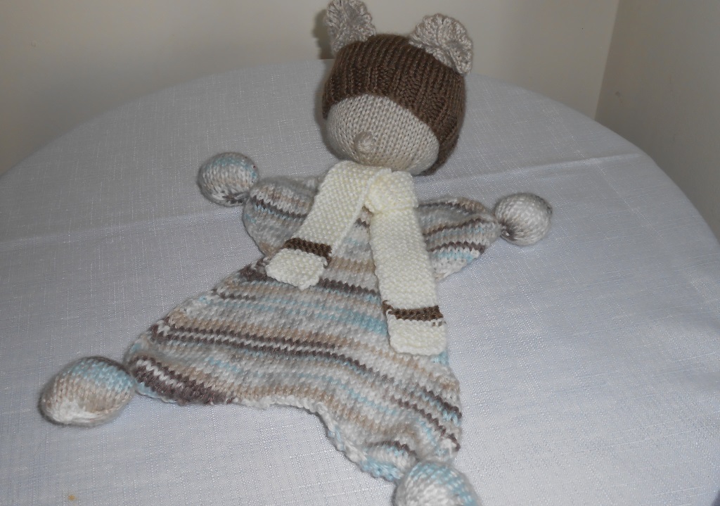 Hand knitted waldorf doll using double knitting method